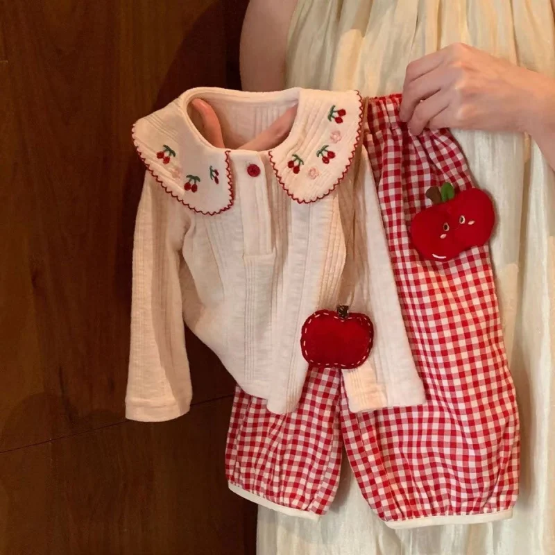 

Girls' Spring Outfit Set2026New Korean-style baby girl two-piece set: lace long-sleeve shirt and plaid straight-leg pants