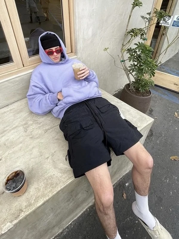 Amerykańskie luźne spodnie męskie w stylu high street, letnie, modne, wielofunkcyjne spodnie robocze do kolan.