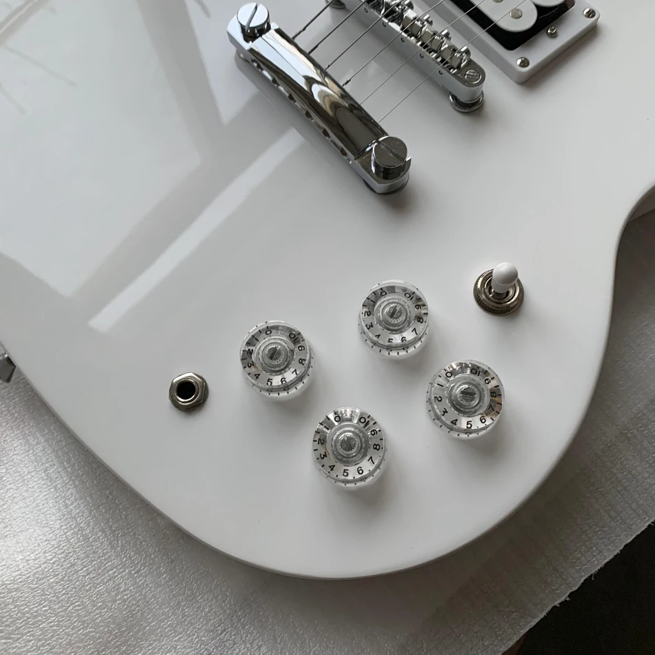 High mountain white electric guitar, transparent knob, peach blossom wood, made in China