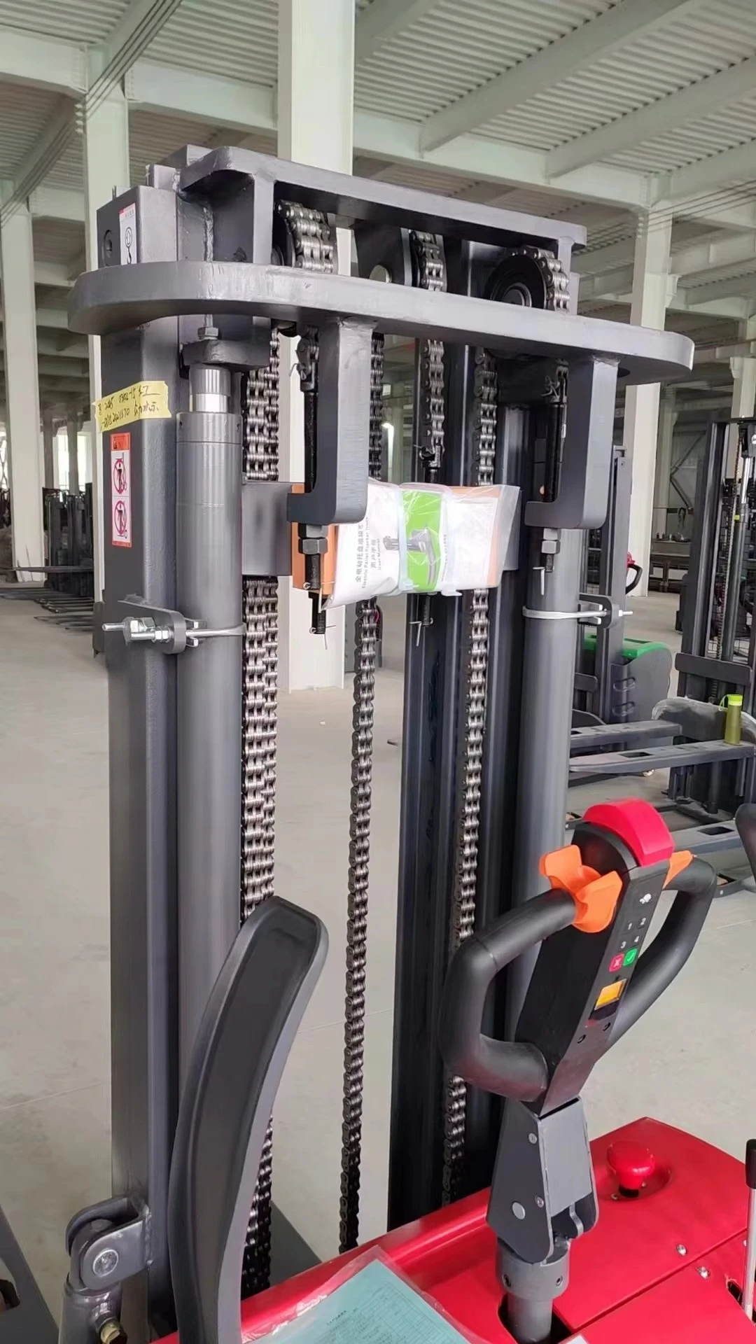 Customized Heavy-Duty Stand-On Mini Electric Stacker with Three-Stage Mast Lead-Acid Battery Power New Condition