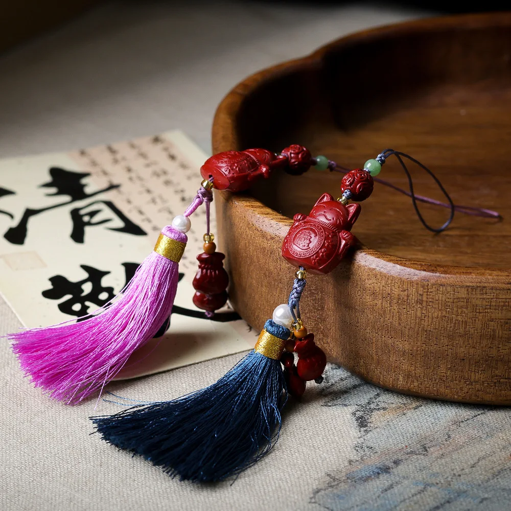 

Original purple and gold sand beckoning cat cinnabar money bag pendant literary toys handmade tassel bag hanging mobile phone