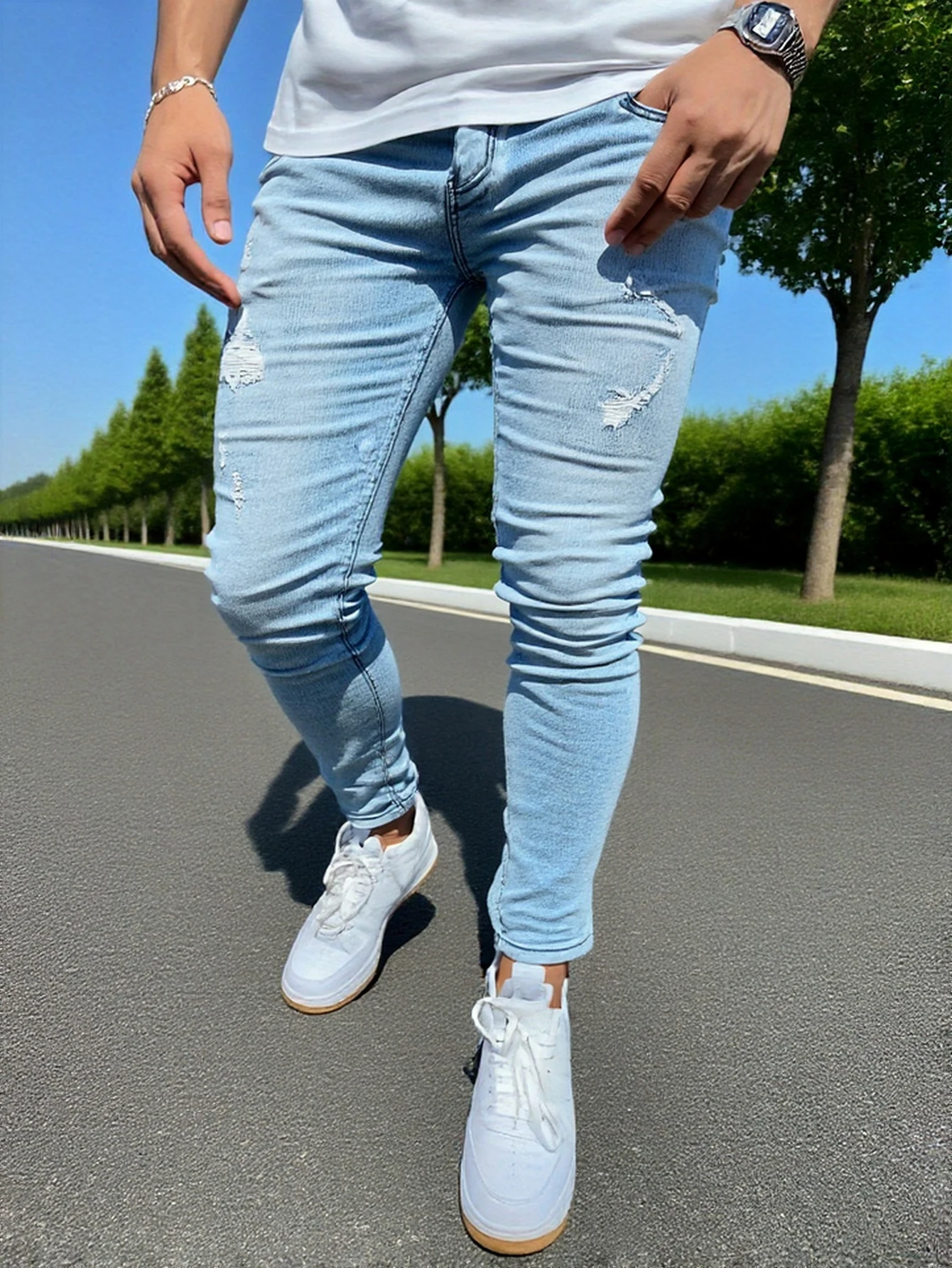 

Men's light blue distressed skinny jeans, featuring a unique worn-out design that fits the body shape perfectly, easily creating