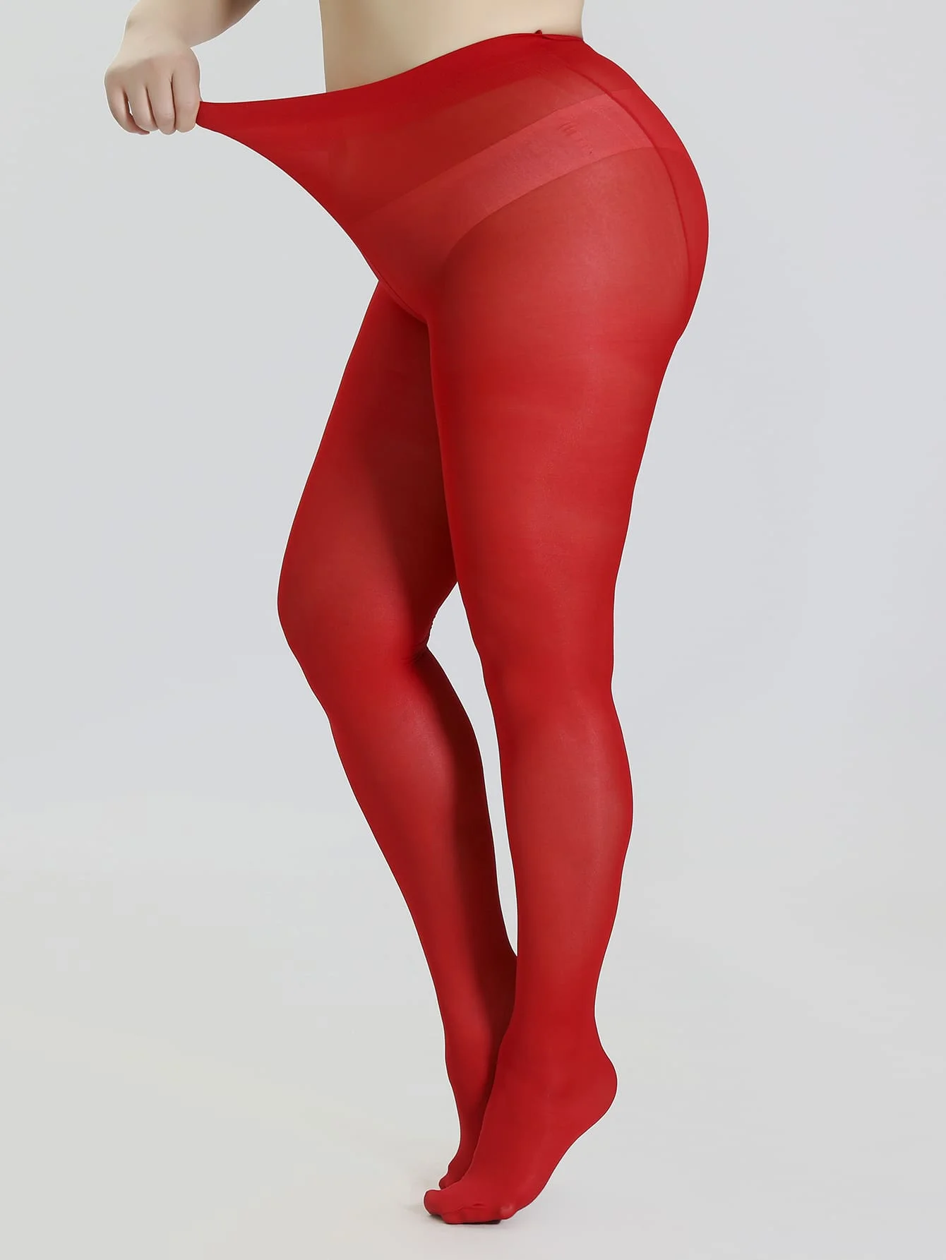 A pair of red women\'s fashionable oversized pantyhose