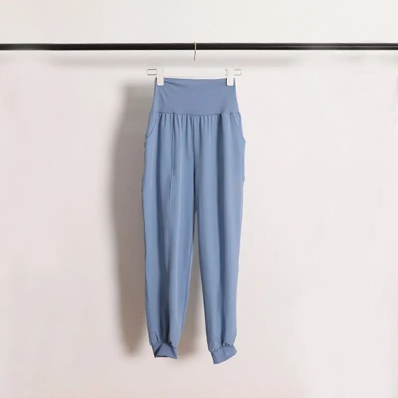 Damskie spodnie do jogi z średnim stanem, modelujące pośladki, do biegania, fitness, długie, elastyczne, szybkoschnące spodnie sportowe.