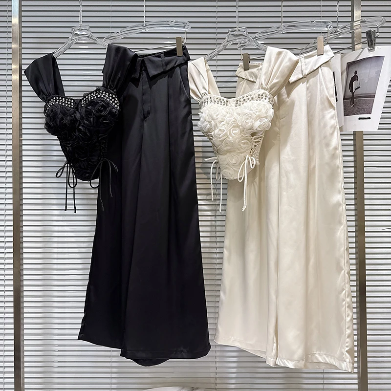 

Новинка Весна 2026: Элегантный комплект из двух предметов для женщин – топ с дизайнерскими бретелями и стразами + свободные широкие брюки