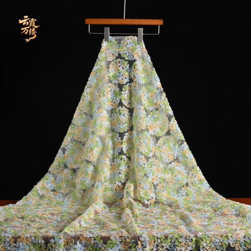 The soft mesh lace jacquard fabric with gradient patterns can be cut into embroidered dress designer