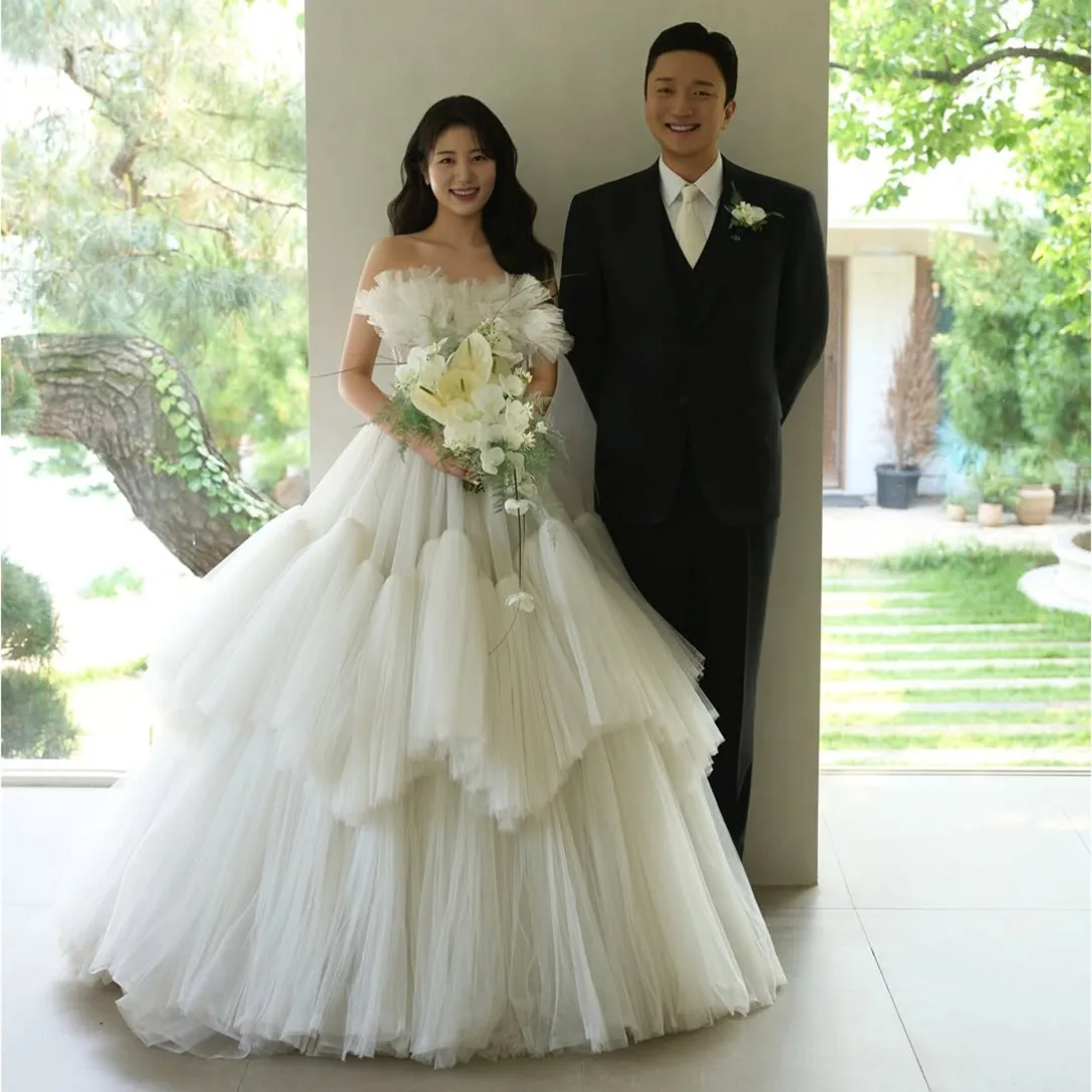 

Customized Long Strapless Tiered Wedding Dresses Ruffled A-Line Tulle Watteau Train Lace Up Back Bridal Gowns for Women