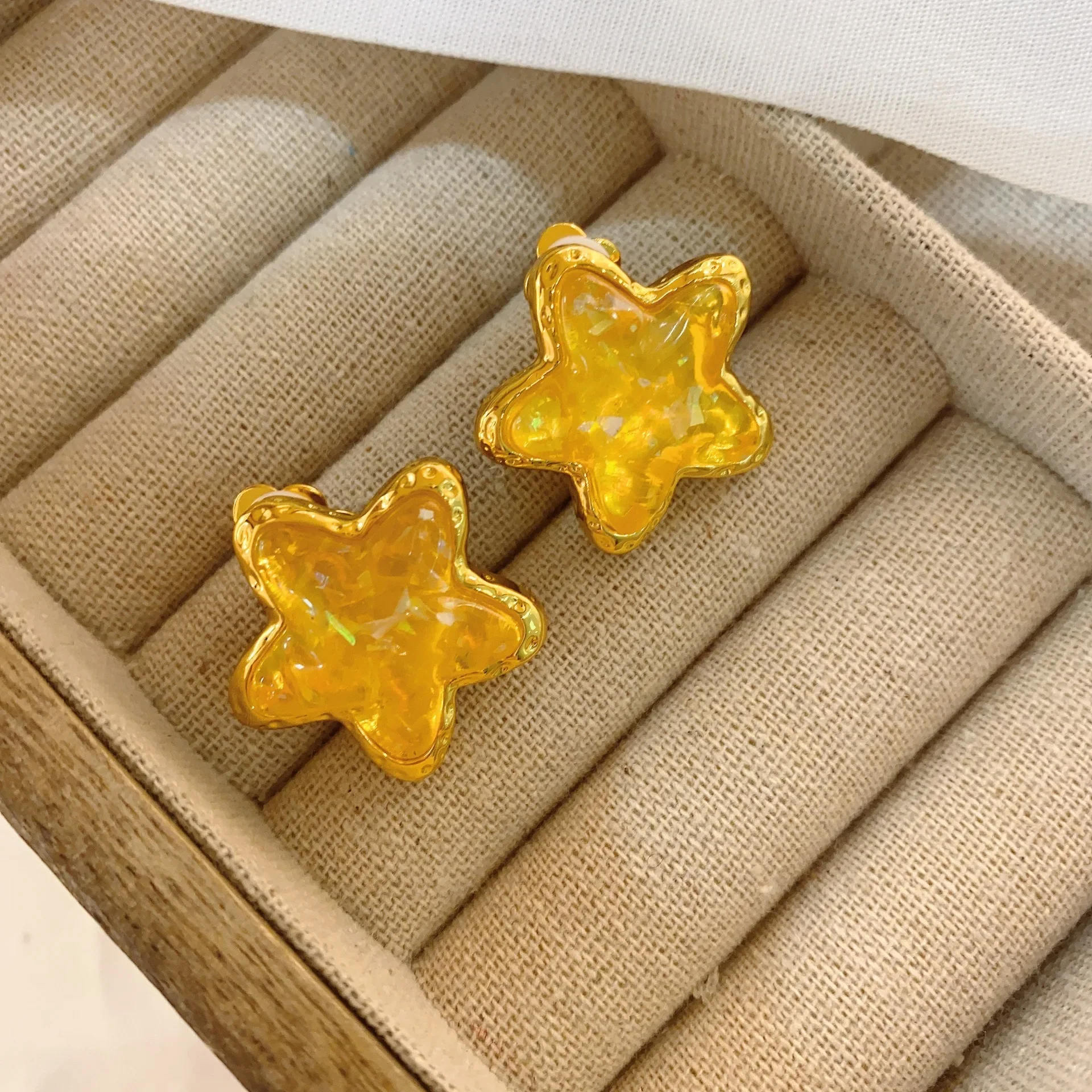 

Vintage Milk Yellow Resin Starfish Ear Clip Without Ear Holes, Can Be Worn in A Cute and Stylish Luxury Style. Unusual Jewelry