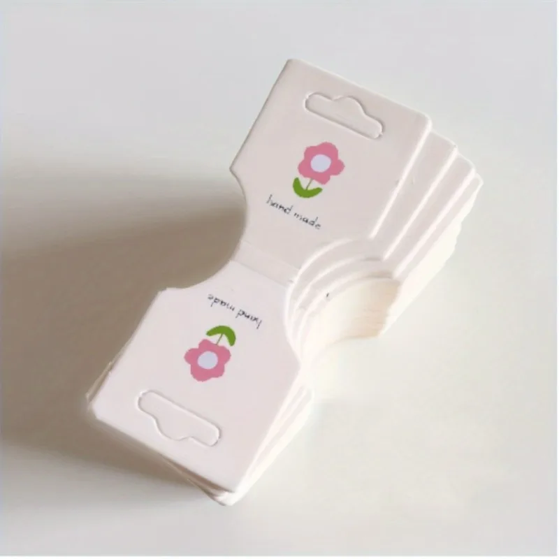 

100pcs Flower Fold Jewelry Display Cards for Necklaces, Bracelets - Durable Paper Card Packaging with Small Floral Print