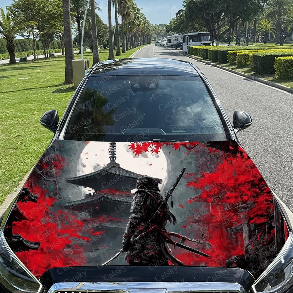 

This car hood wrap features a samurai warrior with swords, set against a backdrop of red maple leaves and a traditional Japanese