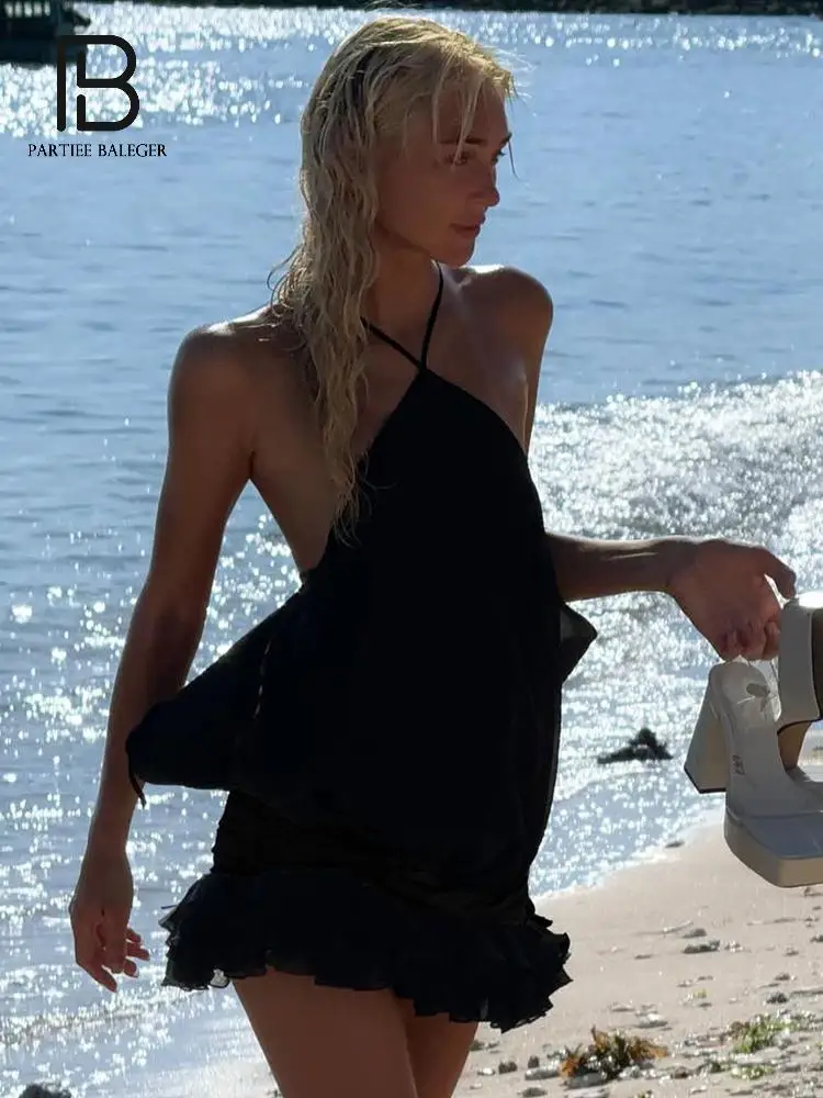 

PB Chic Black Halter-Neck Beach Mini Dress with Ruffled Hem and Lace-up - Perfect for Seaside Getaways & Forward Outings