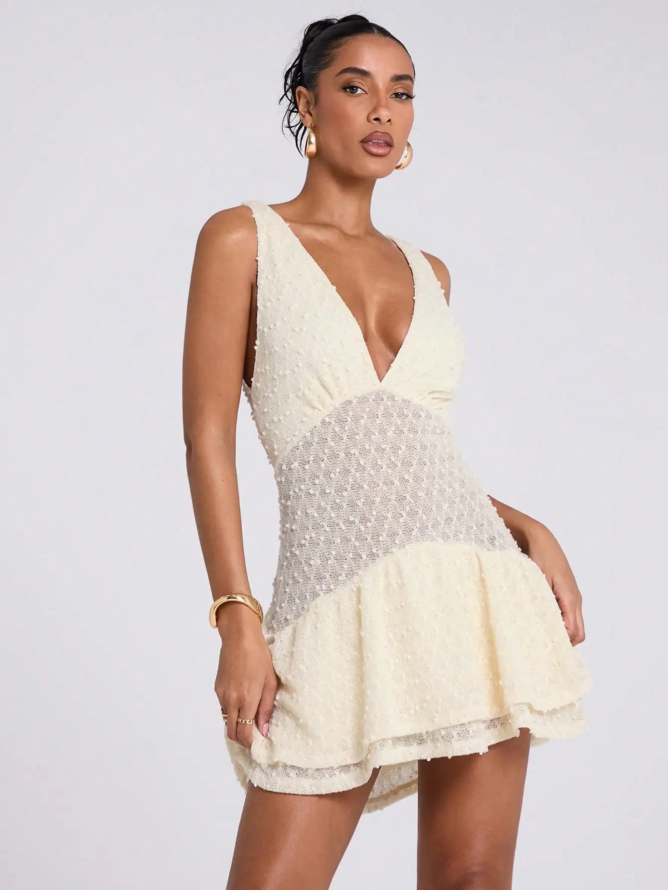 

Cream V-Neck Sleeveless Crochet Mini Dress with Ruffle Hem and Sheer Panel