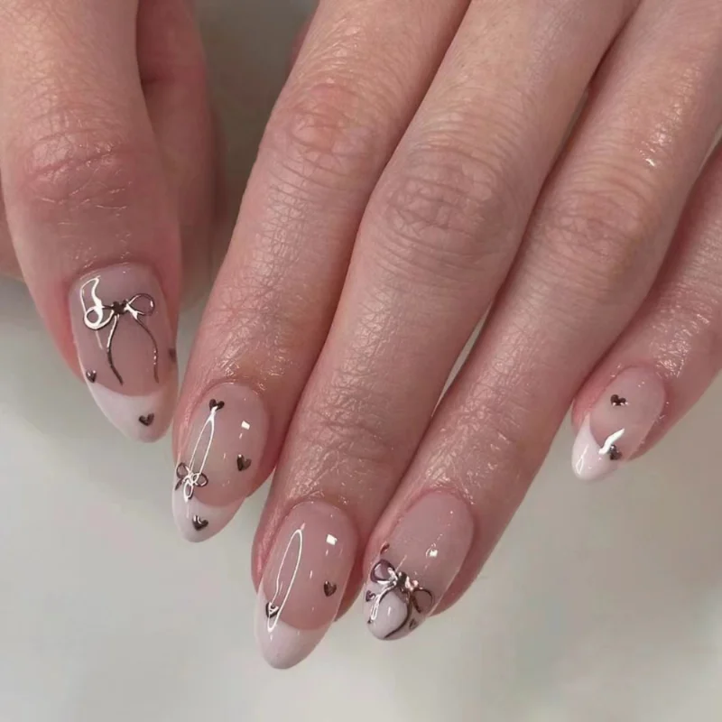 

24Pcs Short Almond Press-on Bow Nails Gentle Nude Pink French Edge Fake Nail Tips with Heart Pattern for Girls Daily Nail Art