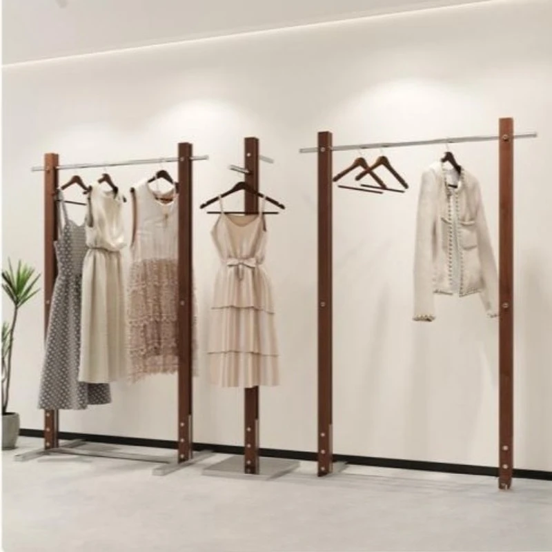 

Clothing store display rack walnut on the wall, stainless steel, floor hanger, women's clothing Nakajima display