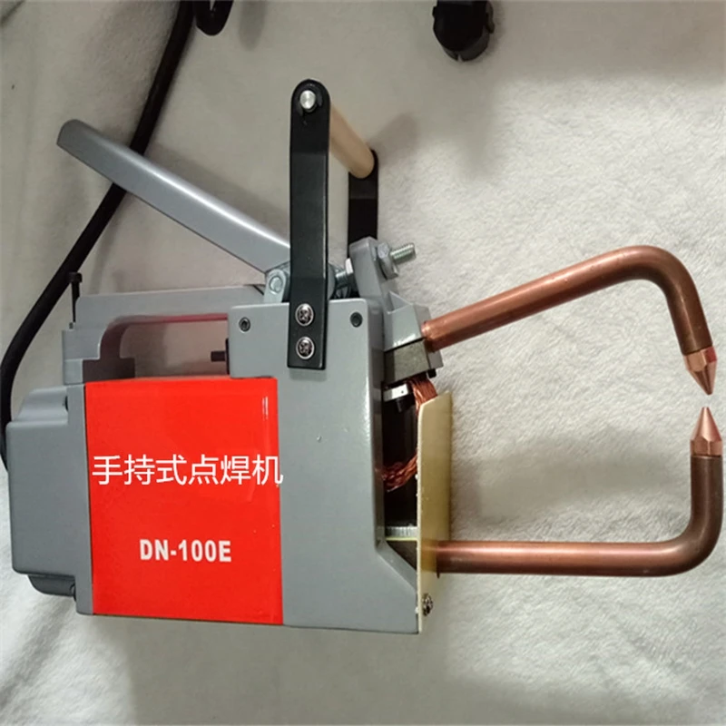 DN-100E มือถือ Spot เครื่องเชื่อมมือถือเหล็ก Plat Joint แบบพกพาจุดเชื่อมเครื่องสะพานสูบลมเข็มขัดการเชื่อมต่อ