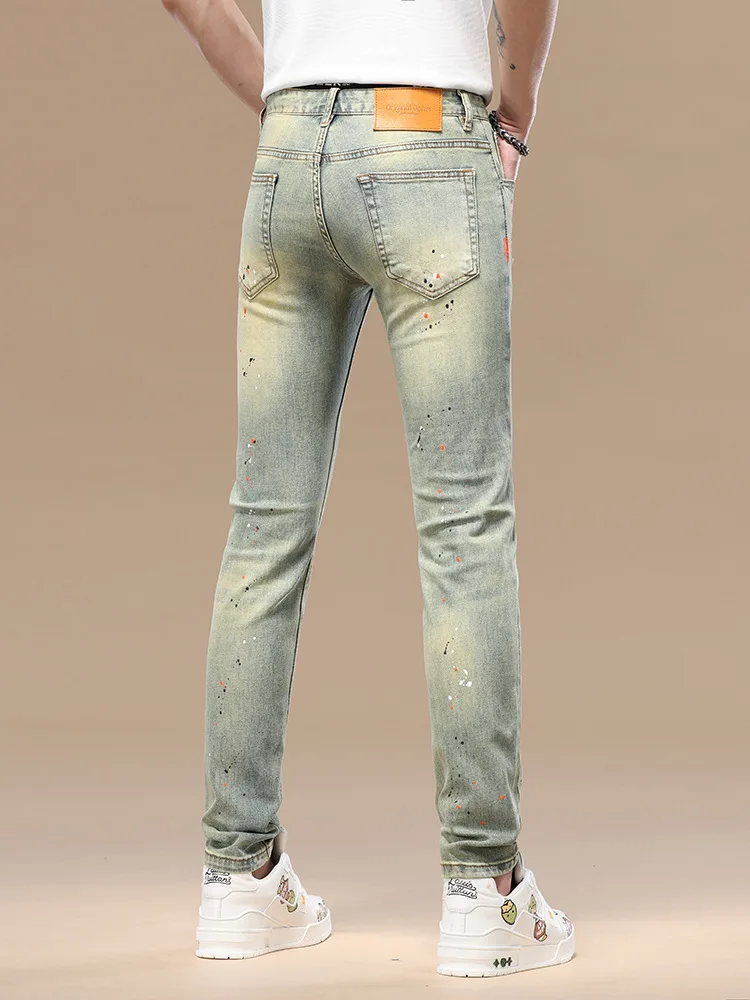 

High end distressed retro jeans men's nine inch slim fit small feet splashed ink 2025 spring/summer new elastic trendy pants