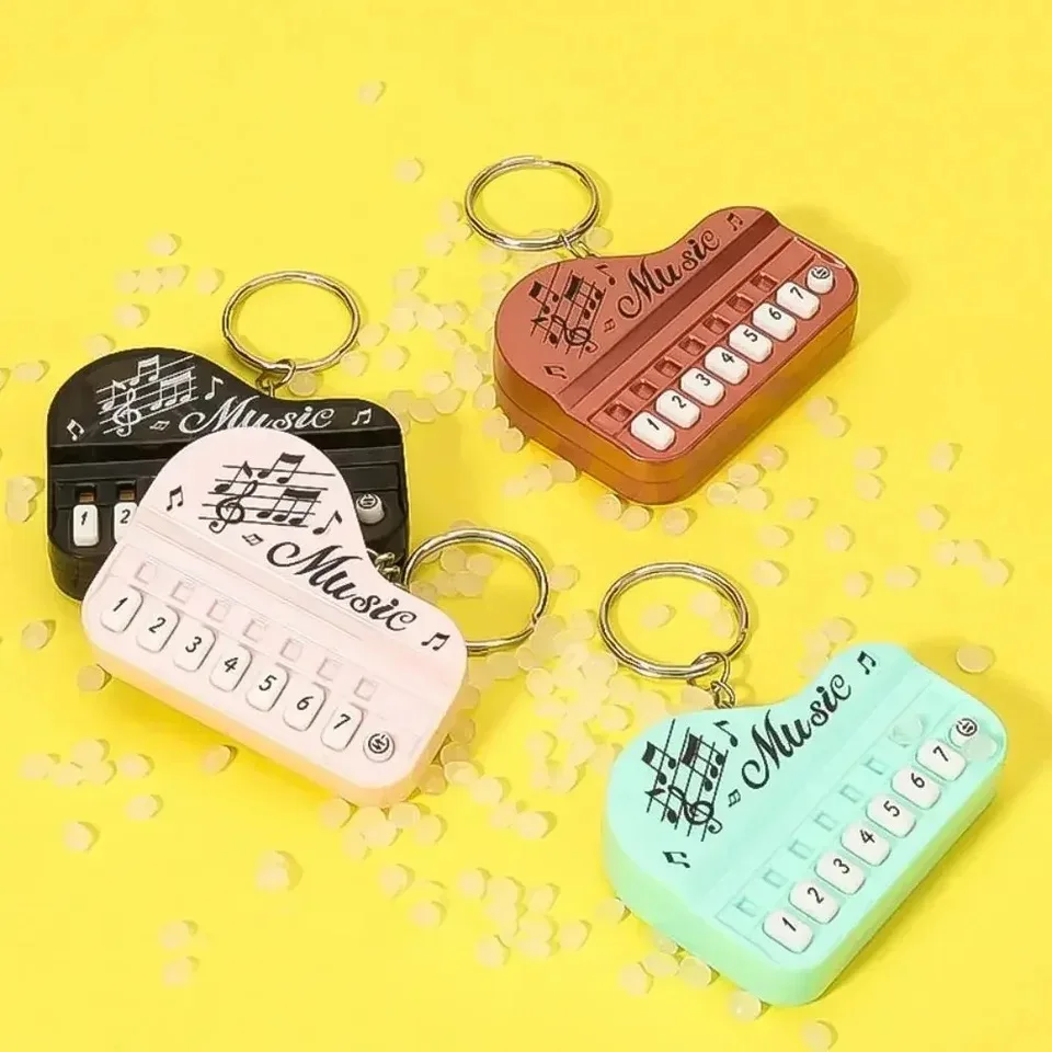 1Pc Mini Luminous Electronic Piano Keychain Portable Handheld Small Electric Musical Instrument Pendant Creative Cute Music Toy view 2