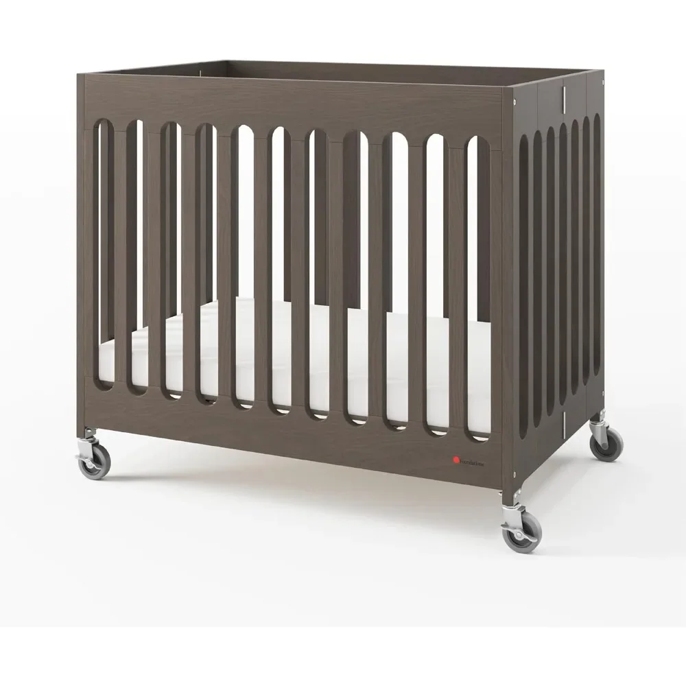 Foundations Boutique Compact Folding Crib, Mini Crib for Guest Rooms, Vacation Homes, and Small Nurseries, Modern Design