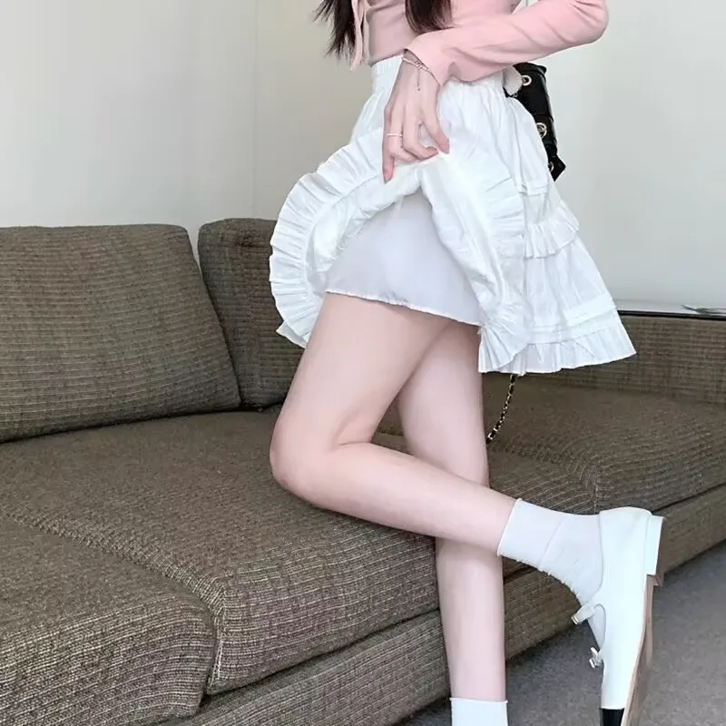 لوليتا التنانير الصغيرة للنساء Kawaii تنورة عالية الخصر ألف خط الكشكشة القوطية الصلبة بسيطة مطوي تنورة Y2k Harajuku تنورة بيضاء