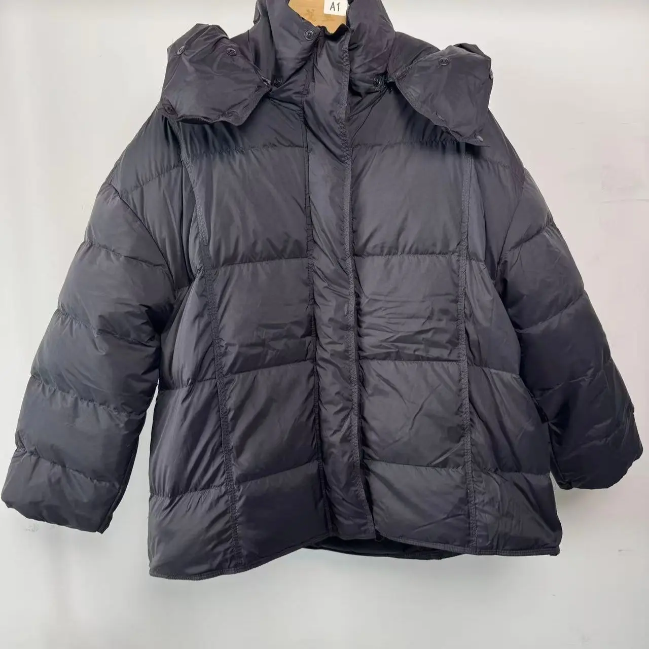 ヨーロッパの冬ホワイトダックダウン新しい女性のダウンジャケットルーズフード付き通勤特大ダウンジャケット