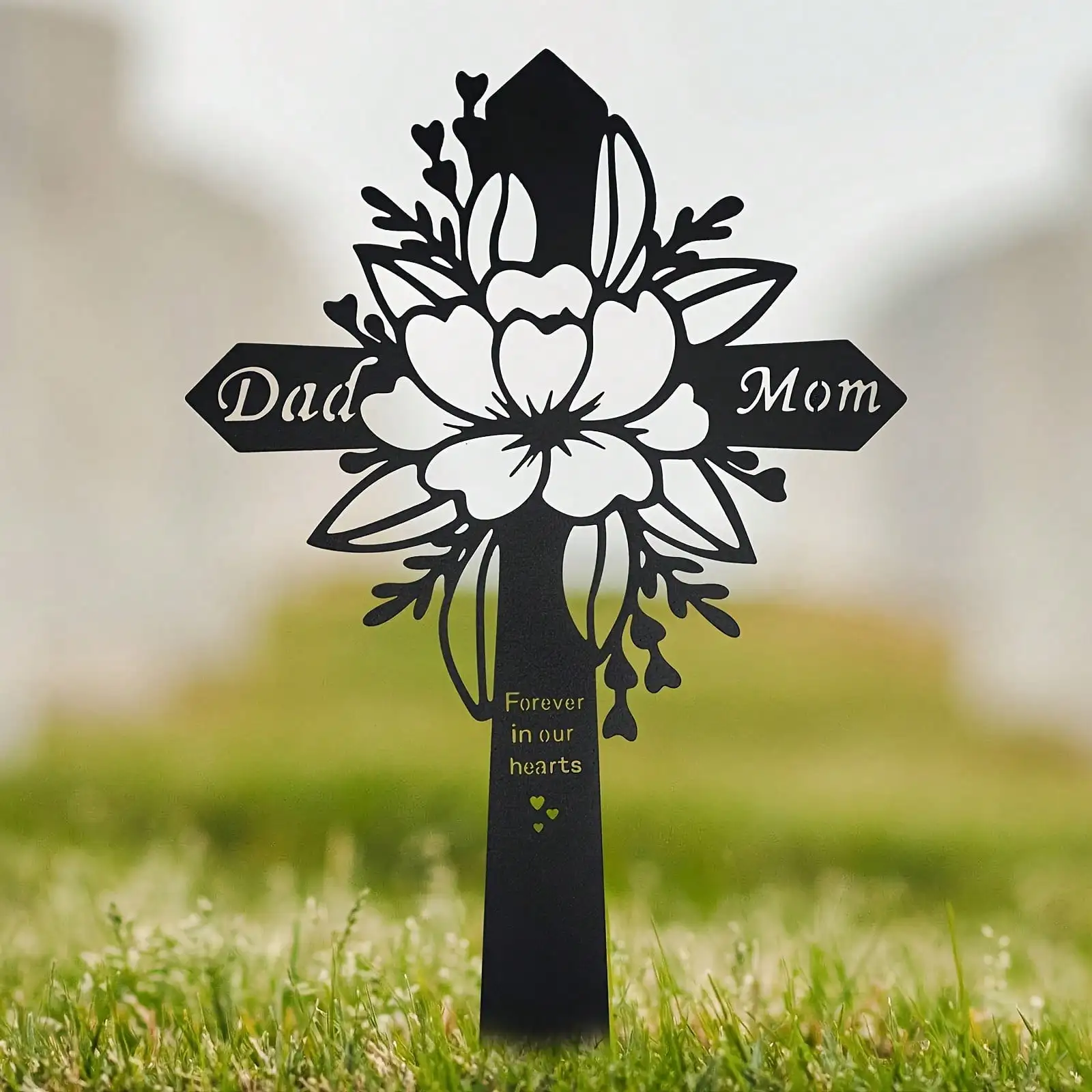 Cross ironwork outdoor plaque decoration for memorial stake in front of parents' grave