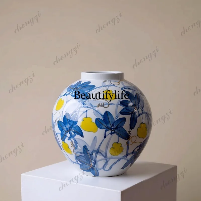 Purely hand-painted blue-and-white with gold accents, Oriental aesthetic round-bellied ceramic flower vessel, light luxury