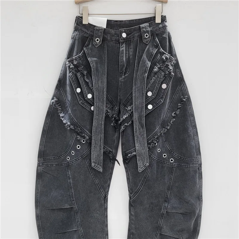 

Deconstructed cargo jeans with curved legs & raw hem. Asymmetric design, utility chic. Your new edgy statement piece.