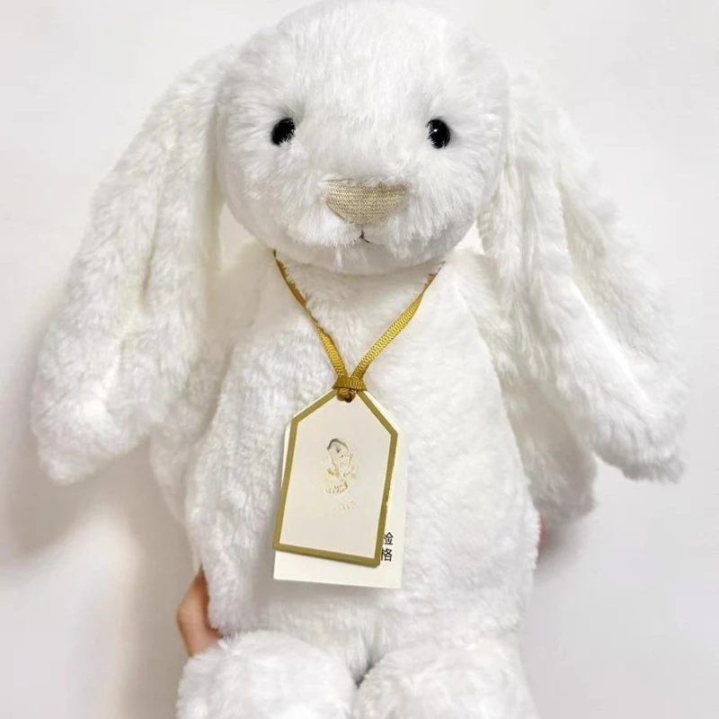 O novo brinquedo de pelúcia Golden Bonny Bunny acalma a boneca para dar um presente de aniversário a um amigo.