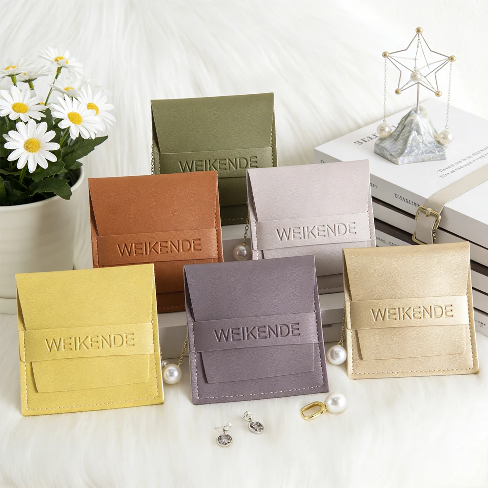 

Custom Logo 100Pcs Jewelry Pouch Packaging Bag Leather PU Flip Gift Bracelet Necklace Earrings Rings Party Favor Sack