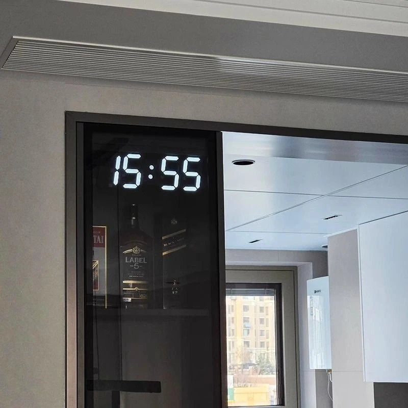 

Remote control, digital electronic clock, large-screen digital clock on the wall in the living room