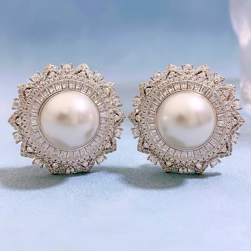 2024 flower shaped pearl earrings with 925 silver inlay and 12mm pearl European and American women's earrings ear clip