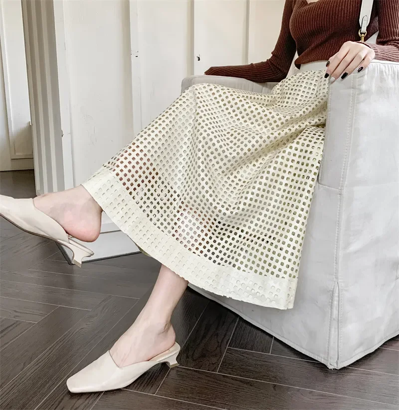 Kunstleer rok voor dames 2025, herfst winter, modieus, elegant, uitgehold, een lijn, hoge taille, lange PU-rok, vrouwelijk