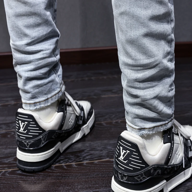 

Fashionable Y2K jeans, blue leather perforated patch, washed nostalgic stretch slim fit, light blue jeans, designer hip-hop bran