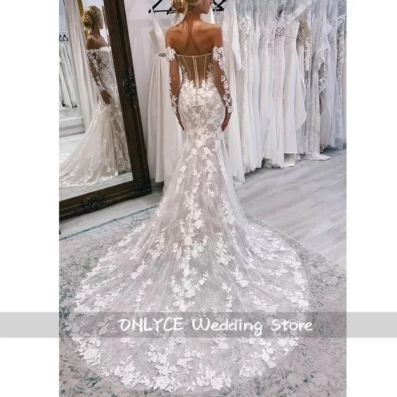 Suknia ślubna na zamówienie, luksusowa, z długim rękawem, szyfonowa, tiulowa, w stylu boho, z koronkowymi aplikacjami.