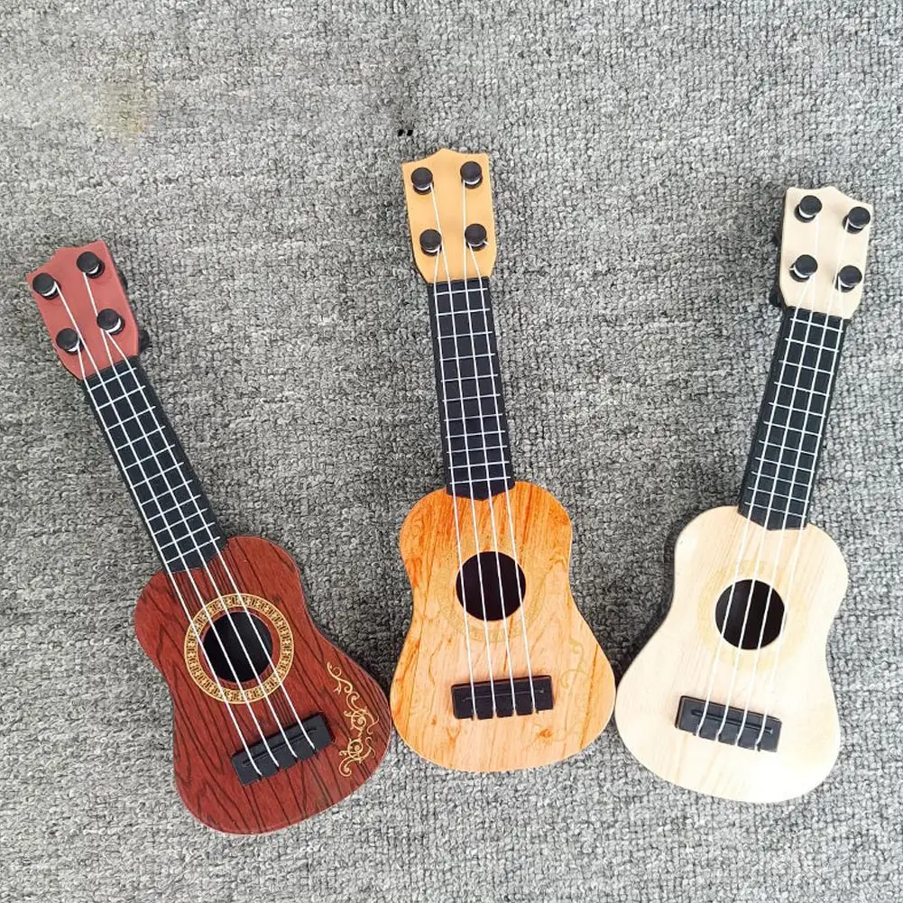 Mini chitarra 4 corde chitarra classica Ukulele educazione della prima infanzia giocattolo strumenti musicali regali di compleanno per bambini