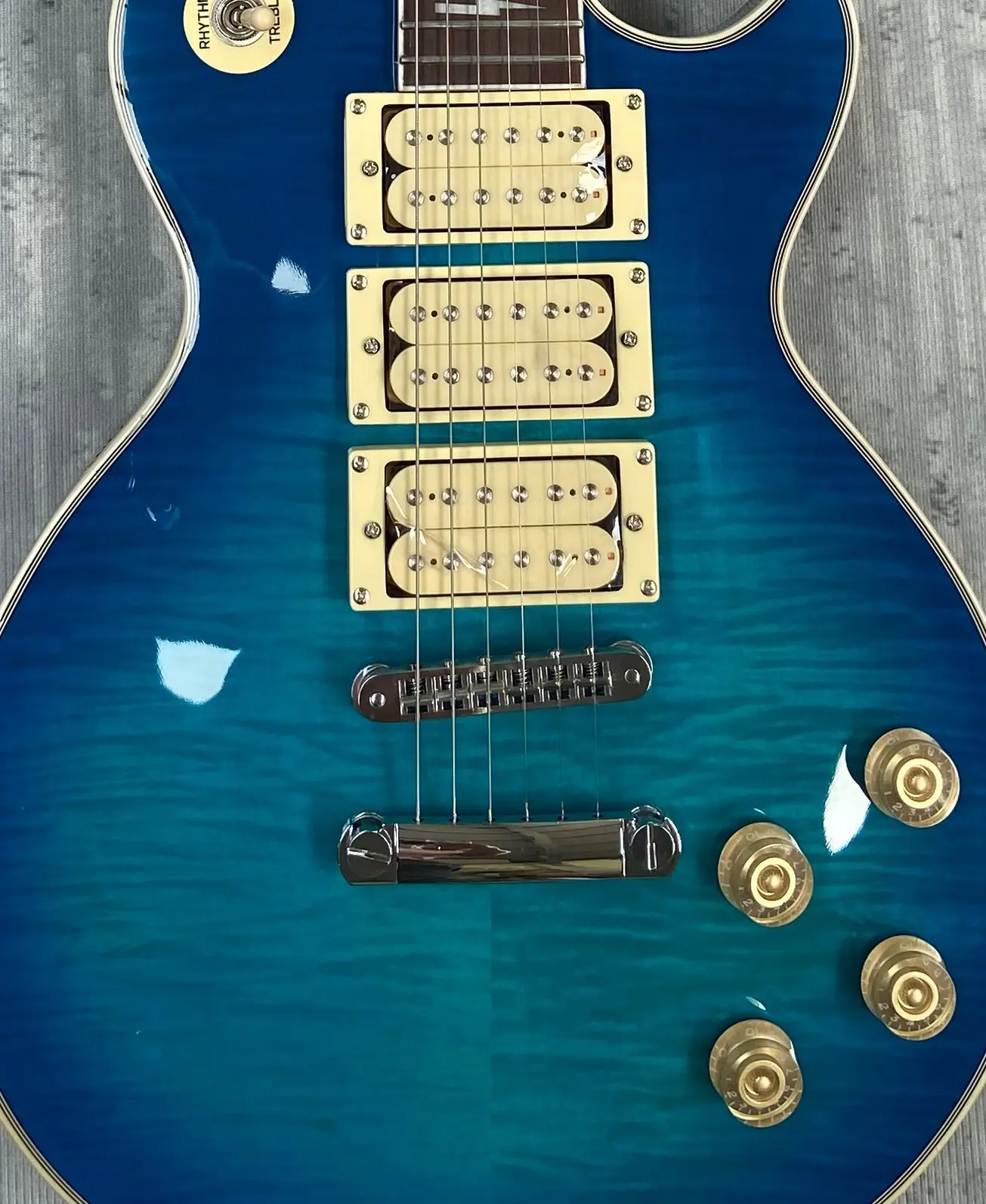 3 Pickup electric guitar. Flame maple, blue.12F has signature have logo, electric guitar, 3 days delivery made in China