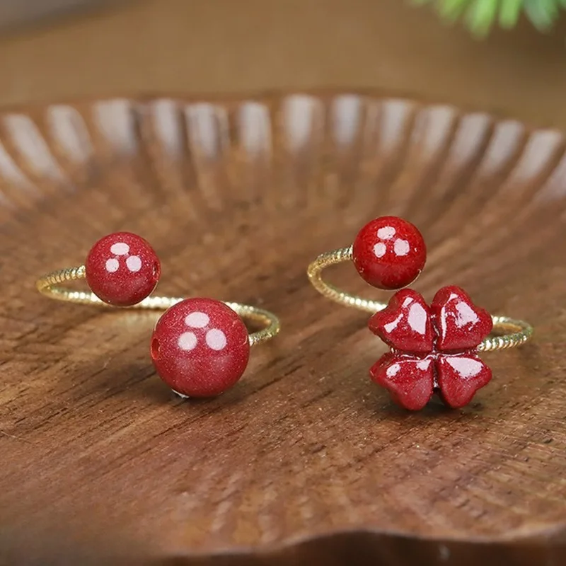 

Кольцо из натуральной киновари High-font фиолетового золота с песком, кольцо с четырьмя листами клевера.