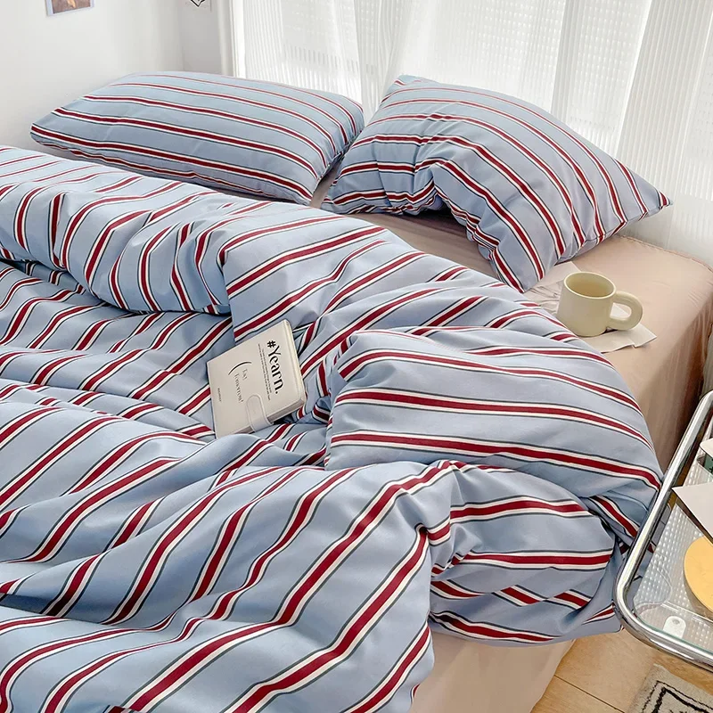

Simple Red and Blue Striped Duvet Cover and Four Piece Bed Sheet Set with Washed Cotton Bedding on the Bed