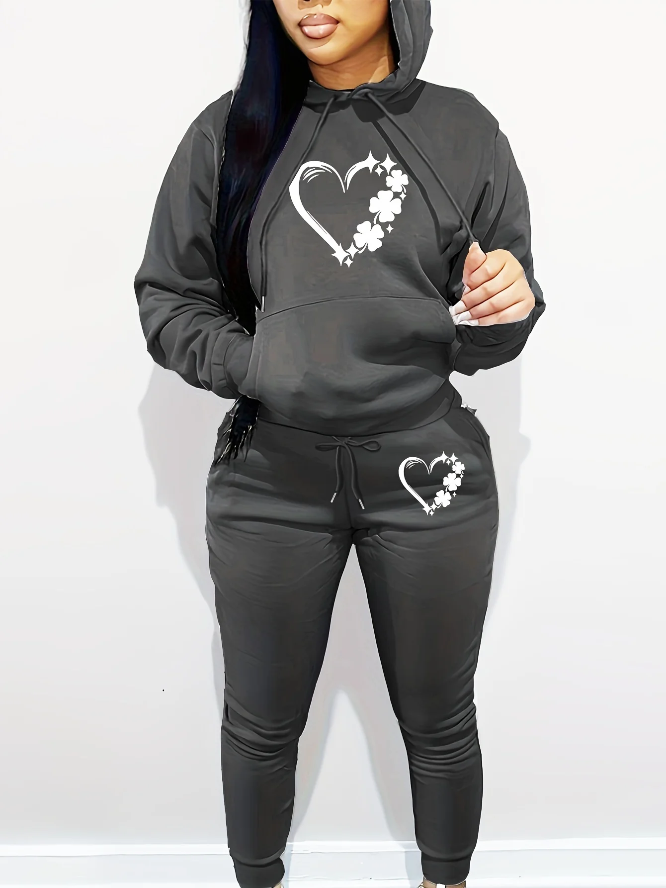Fashion two‑piece set features delicate heart print on the hooded long‑sleeve top