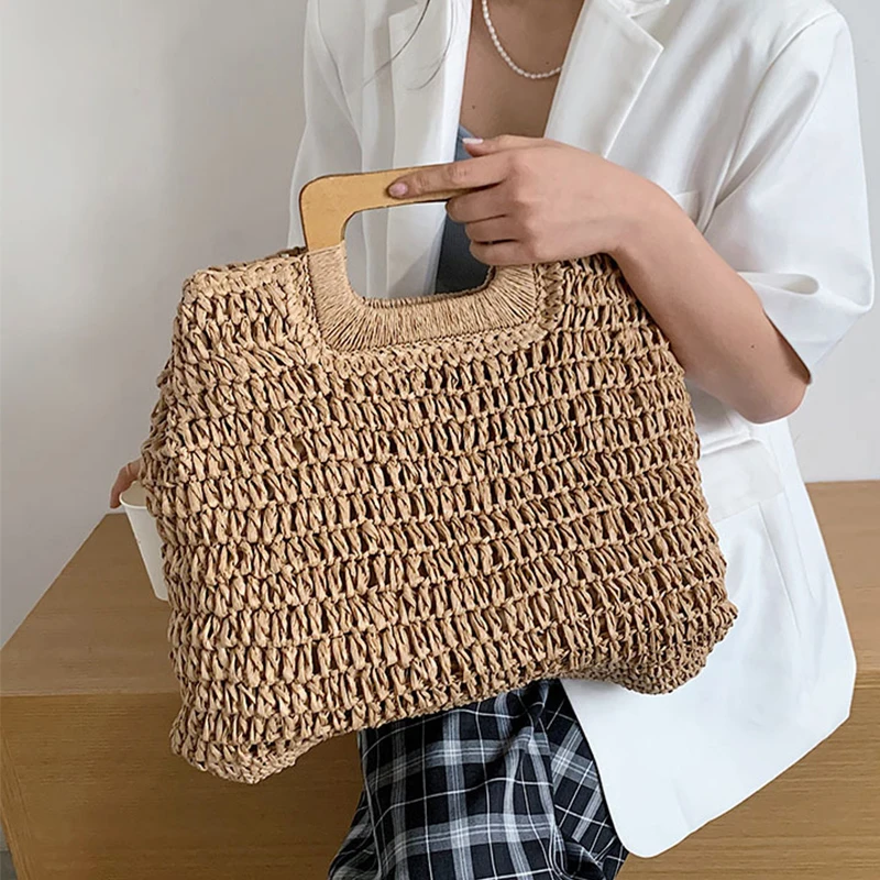 Borsa estiva in paglia intrecciata borsa con manico in legno femminile borsa da spiaggia da viaggio di grande capacità Totes stile moda scava fuori