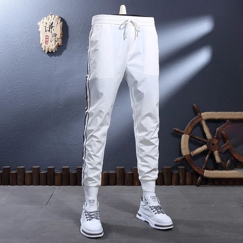 

Летние тонкие, крутые, дышащие, эластичный пояс, белая резинка, приталенный крой, завязка на щиколотке, повседневные брюки, мужские спортивные брюки