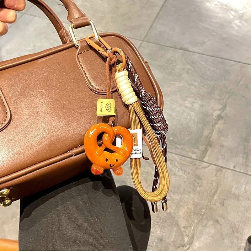 الإبداعية Bowknot المنسوجة حبل المفاتيح الشوكولاته الخبز الخبز المفاتيح البوليستر مكافحة خسر حقيبة الديكور المنسوجة