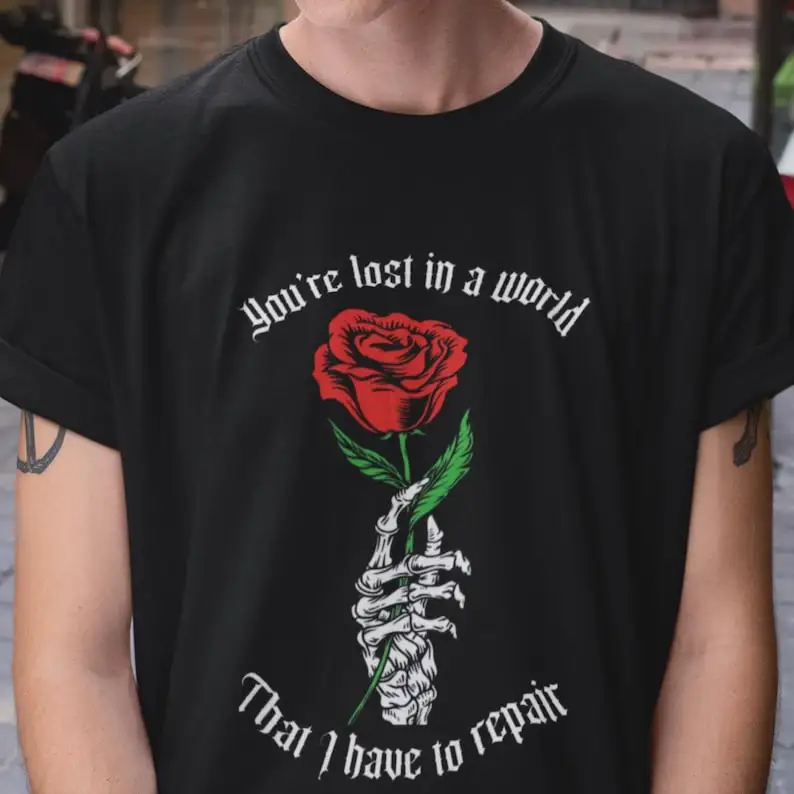 

Gothic skeleton hand holding a rose t-shirt, romantic dark aesthetic tee, alternative fashion, vintage gothic style, unique gift