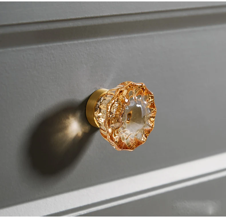 Champagne faceted knob fitted to a dark grey drawer