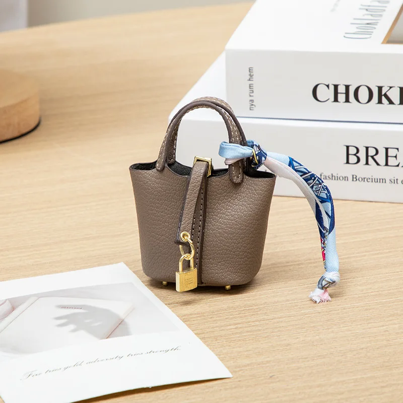 2026 Mini-Taschenanhänger Schlüsselanhänger Hängeaccessoire Zero Wallet Kreatives tragbares Armband Bluetooth-Kopfhörertasche Multifunktional – Detail 9