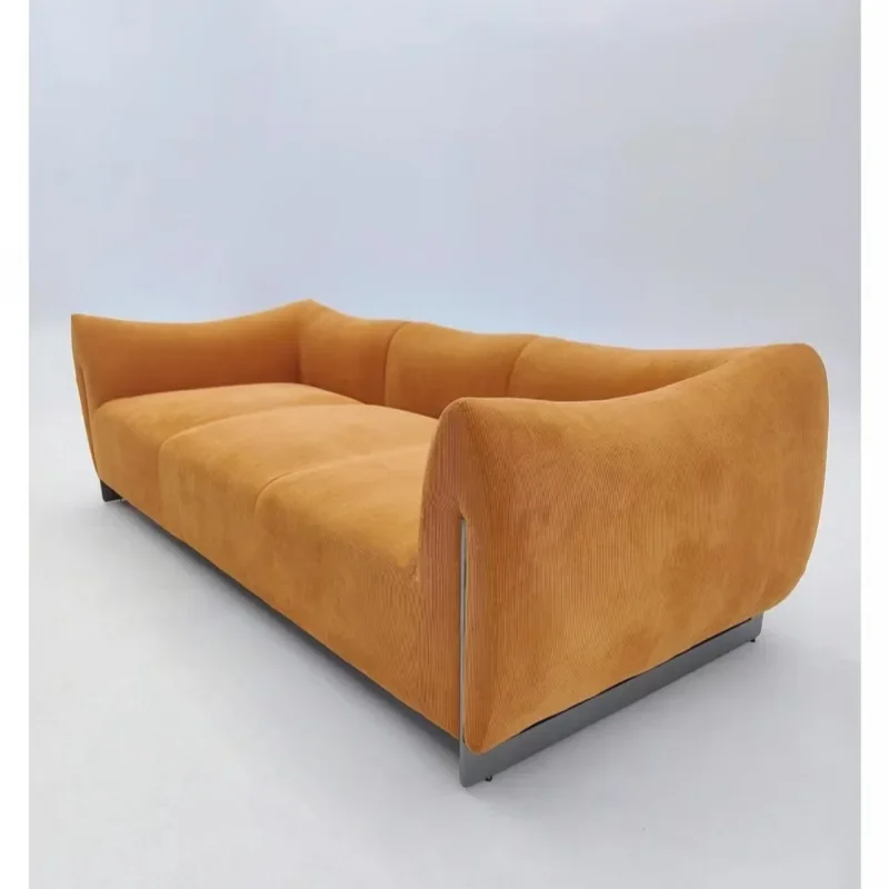 Niche designer corduroy dopamine color scheme retro metal base horn cloud sofa