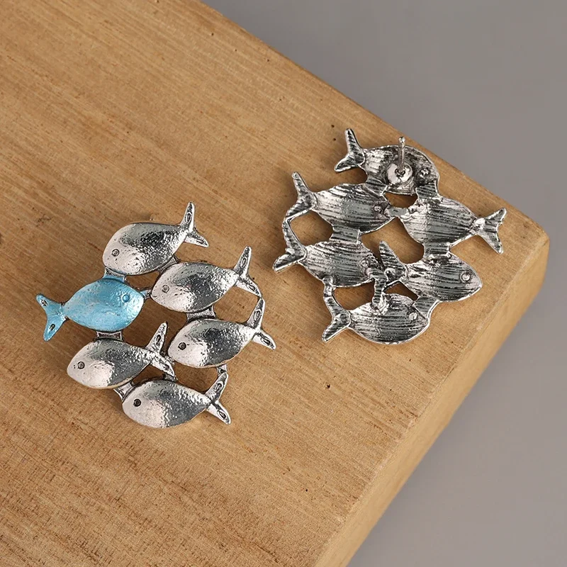 Swimming Against The Current Silver Color Stud Earrings. Mismatch. School of Fish with One Blue Swimming Upstream