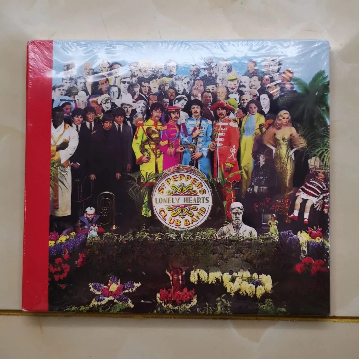 

Timeless Psychedelic Rock CD with Iconic Surreal Collage Art Print, Features Orchestral Arrangements & Experimental Vibes