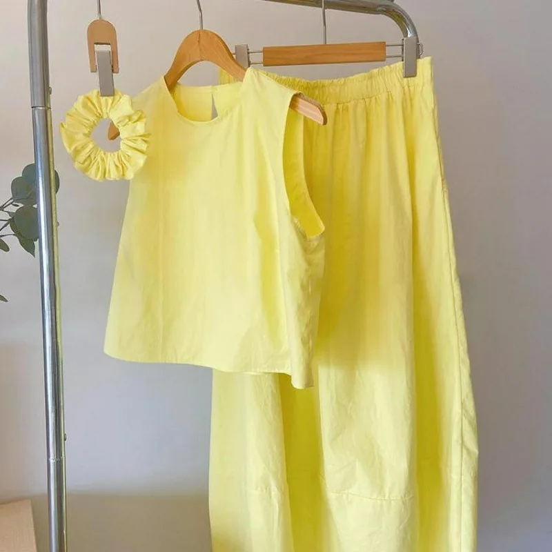 202-neues Sommer-Damen-Set, modisch, stilvoll, ärmellos, gelbes rückenfreies Hemd, hohe Taille, schlankmachender A-Linien-Langrock