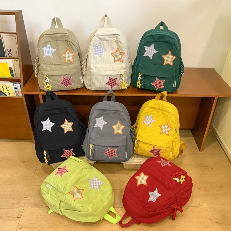 Striped corduroy solid color large-capacity student schoolbag, cute star-shaped lady's load-reducing travel backpack